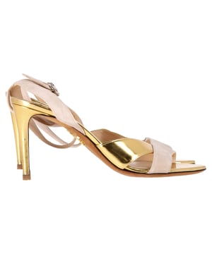 VINTAGE, RRP AS NEW
Step into refined elegance with the Prada Ankle Strap Sandal Heels, featuring a graceful blend of nude suede and gold leather for a luxe, feminine finish. The delicate ankle strap and sculpted heel offer both support and sophistication, perfect for special occasions or elevated everyday wear. Style them with a silk midi dress or tailored jumpsuit to highlight their subtle shimmer and elongate the silhouette.

 Prada Ankle Strap Sandal Heels in Nude and Gold Suede and Leather

Condition: Very good
Signs of wear: Minor markings, Lightly used but very well maintained. Minor mark at soles & creasing, light scuffing at the soles and heels.
Packaging: None
Color: Nude
Material: Suede | suede
Size: IT | 39.5
Measurements: Heel height: 90; Insole length: 270
SKU: NAPPUGBSH503388W