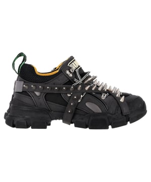 VINTAGE, RRP AS NEW
The Gucci Flashtrek Sneakers in black leather take utility style to luxury heights. Crafted with a panelled mix of leather and mesh, they feature detachable leather straps adorned with antiqued silver-tone conical spikes for a statement-making, customizable look. From the sculpted rubber sole to the woven black-and-white laces and green webbing heel loop, every detail screams boldness with intention.


Gucci Flashtrek Removable Spikes Sneakers in Black Leather
Condition: very good
Signs of wear: No visible sign of wear. No Mark at insole.,  Very light mark at soles.
Packaging: None
Color: black
Material: Leather | leather
Size: EU | 42
Measurements: Heel height: 60; Insole length: 310
SKU: NAPPUGBSH507540W