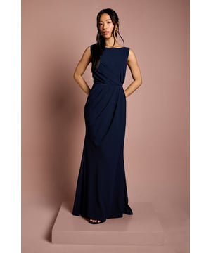 Elegant boat neckline creates a sophisticated silhouette perfect for bridal party ensembles
        Luxurious satin georgette fabric drapes beautifully for a graceful, flowing effect
        Stunning lace back detail adds a romantic touch with delicate scalloped edges
        Floor-sweeping maxi length offers timeless bridal party elegance
        Gathered waist design creates a flattering shape whilst maintaining comfort throughout the celebration
    
    This exquisite Coast bridesmaids dress combines classic elegance with contemporary detailing, making it the perfect choice for your bridal party. The refined boat neckline frames the dcolletage beautifully, whilst the flowing maxi silhouette creates a graceful presence as you move down the aisle. The showstopping feature is undoubtedly the intricate lace back detailing, offering a romantic contrast to the smooth satin georgette fabric. Style with delicate drop earrings and an elegant updo to showcase the beautiful back detail. For a coordinated bridal party look, this dress works wonderfully in matching tones or complementary shades within your wedding colour palette. The gathered waist ensures comfort throughout the ceremony and reception, allowing bridesmaids to move with ease whilst maintaining that picture-perfect silhouette as they support the bride on her special day.