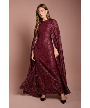 Stunning lace cape gown for elegant occasions
        Intricate floral lace pattern throughout
        Floor-length design with a graceful silhouette
        Dramatic cape sleeves for added sophistication
        Round neckline and fitted bodice for a flattering shape
    
    Make a lasting impression at your next formal event with this exquisite lace cape gown from Coast. The all-over floral lace pattern adds a touch of romance and femininity, while the floor-length design ensures a graceful and sophisticated appearance. The standout feature of this gown is undoubtedly the dramatic cape sleeves, which flow elegantly from the shoulders, creating a regal and ethereal effect. Perfect for weddings, race days, or black-tie affairs, this gown is a versatile choice for the discerning woman who appreciates timeless elegance. Style it with strappy metallic heels and statement earrings to complete your look. The fitted bodice and round neckline create a flattering silhouette, while the long, flowing skirt adds movement and drama. This gown is sure to turn heads and make you feel like royalty at any prestigious occasion.