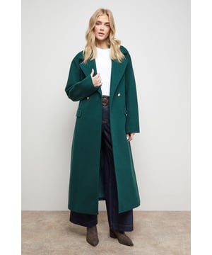 Elegant midi-length coat with a flattering tie belt detail to define the waist
        Classic collared neckline with a sophisticated double-breasted front closure
        Practical side pockets perfect for keeping essentials close at hand
        Versatile regular fit designed to layer comfortably over your favourite outfits
        Fully lined for added comfort and a smooth silhouette
    
    This stunning tie belt midi coat from Oasis brings together timeless style and practical design. The elegant length offers extra coverage whilst the waist-cinching belt creates a feminine silhouette that can be adjusted to your preference. Style with wide-leg trousers and a simple white top for an effortlessly chic daytime look, or layer over your favourite jeans and a cosy jumper for weekend brunches. The versatile design makes it perfect for family gatherings or casual meet-ups with friends. Pair with ankle boots and a cross-body bag for shopping trips, or dress down with trainers for a more relaxed feel. This coat transitions seamlessly from autumn through winter, making it a wardrobe staple that will serve you for seasons to come.