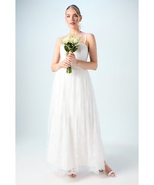 Exquisite lace overlay with delicate embellishment for a touch of bridal luxury
        Floor-length design with a graceful flowing silhouette
        High-waisted fit that creates an elegant, elongated profile
        Scalloped lace hem adding intricate detail to the skirt's border
        Lightweight, layered construction offering beautiful movement as you walk
    
    This enchanting Coast bridal skirt transforms your wedding day ensemble with its ethereal lace detailing and subtle embellishments. The flowing silhouette creates a romantic aesthetic whilst maintaining a contemporary edge, perfect for the modern bride seeking timeless elegance. Style with the matching lace top for a coordinated bridal look, or pair with a simple silk camisole for a more relaxed interpretation. The versatile design works beautifully for both traditional ceremonies and more intimate celebrations, allowing for comfortable movement during your special day. Complete your bridal ensemble with minimal jewellery and delicate strappy sandals to maintain the skirt's sophisticated charm. This piece transitions effortlessly from ceremony to reception, ensuring you remain the picture of grace throughout your celebration.