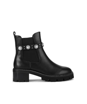 This Kurt Geiger Dome Stud Chelsea Boot is crafted from a black leather. There are multiple silver crystals around the strap on the elasticated ankle. Sole height: 5cm.