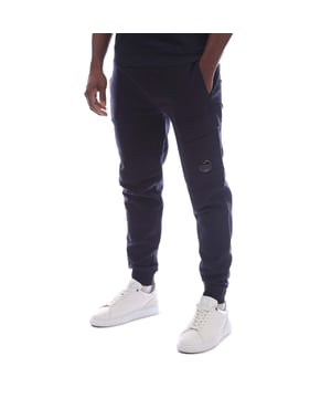 Mens C.P. Company Diagonal Fleece Lens Cargo Sweatpants in total eclipse.Sweatpants crafted in Diagonal Raised Fleece  a medium-weight brushed diagonal-weave cotton.  The soft fabric ensures comfort and ease of movement.  - Ribbed elasticated waist with inner drawcord.- Side welt pockets.- Cargo pocket on left leg with iconic C.P. Company lens detail.- Tapered leg.- Ribbed cuffs.- 100% Cotton.  Machine washable.- Ref: RCCMSP717A 005086W 888