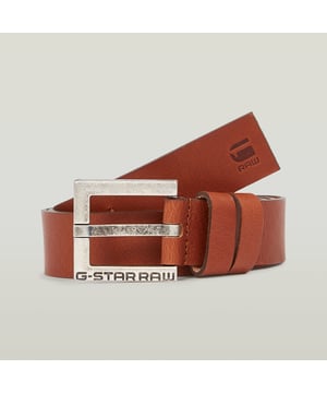 Thick leather strap, crack finish. Painted and polished metal buckle. G-STAR engraved buckle. Stamped logo at the end. Buckle/Bows. Belt New Duko offers a boxy, metal buckle with a full grain leather strap. 100% Buffalo grain leather. Subtle grain structure. Natural state, strong and durable