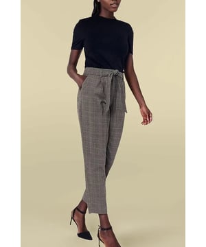 These trousers work as well at the weekend as they do in the office. In an smart peg silhouette that is shaped with pleats through the hip, they have a matching tie belt to define the waist and finish on the ankle so you can pair them with your best shoes. Tuck in a simple tee and heeled ankle boots.