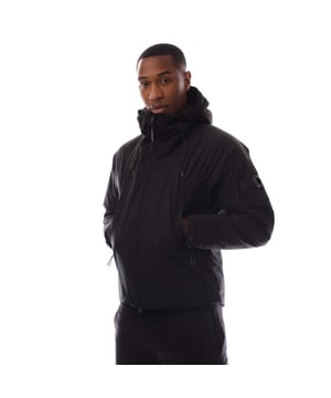 Mens C.P. Company Pro-Tek Hooded Padded Jacket in black.Hooded padded jacket crafted in Pro-Tek  a Polyester mechanical stretch that combines the weight and comfort of a sweatshirt with the protection of an outer layer.  Padded with Primaloft® Silver wadding  an insulation solution with high thermal and breathability properties. Anti-drop treated.- Fixed hood with adjustable bungee drawcord.- Two-way full zip fastening.- Side hidden zip pockets.- Inside chest pocket.- Iconic C.P. Company lens detail pocket at left sleeve.- Adjustable snap cuffs.- Adjustable bungee drawcord at hem.- Primaloft® Silver padding.- Regular fit.- Main material: 100% Polyester.  Lining: 100% Polyamide.  Padding: 100% Polyester.  Machine washable.- Ref: 19CMOW006A 110264A 999