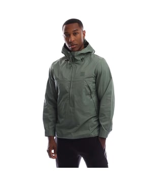 Mens C.P. Company Metropolis Series Gaberdine Hooded Half Zip Overshirt in vibrant green.Half zip hooded overshirt crafted in Gabardine cotton. The overshirt includes an adjustable hood and a rubberized logo badge on the chest.- Fixed hood with adjustable bungee drawcord.- Half zip fastening.- Long sleeves with adjustable button cuffs.- Rubberized logo badge at left chest.- Side hidden zip pockets.- Adjustable drawstring hem.- Regular fit.- 100% Cotton.  Machine washable.- Ref: 19CLOS019A 006472A 619