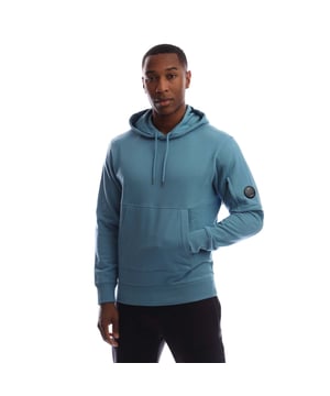 Mens C.P. Company Diagonal Raised Fleece Lens Hoodie in Aegean blue.Hooded sweatshirt crafted in Diagonal Raised Fleece  a medium-weight brushed diagonal-weave cotton.  The soft fabric ensures comfort and ease of movement.  - Adjustable hood.- Kangaroo pocket.- Iconic Lens pocket at left sleeve.- Ribbed cuffs and hem.- Regular fit.- 100% Cotton.  Machine washable.- Ref: 19CMSS714A 005086W 815