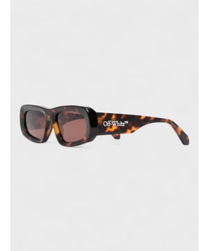 Elevate your style with the Off-White Austin Sunglasses in rich Havana Brown. These designer frames combine timeless tortoiseshell patterns with Off-White's signature contemporary edge. Perfect for making a fashion statement while protecting your eyes, these sunglasses add instant sophistication to any outfit. An essential accessory for the fashion-forward individual who appreciates luxury with attitude.
OERI065S23PLA0016064