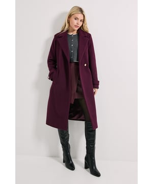 Longline silhouette with elegant belted waist for a flattering, defined shape
        Classic collared neckline adding a touch of sophistication to your outerwear
        Practical side pockets perfect for keeping essentials close at hand
        Versatile regular fit allowing comfortable layering over your favourite autumn and winter outfits
        Woven fabric construction offering structure and warmth for cooler seasons
    
    Make this Dorothy Perkins longline coat the cornerstone of your seasonal wardrobe. The timeless belted design creates a beautifully feminine silhouette while maintaining everyday practicality. Style with a button-up shirt and leather-look skirt for weekend brunches with friends, or pair with slim trousers and knee-high boots for family gatherings. The versatile nature of this coat means it works brilliantly with both casual and smart-casual ensembles - throw over a jumper and jeans for school runs, or layer atop a midi dress for baby showers. The structured collar and clean lines reflect contemporary British style whilst maintaining the wearability Dorothy Perkins is known for. This coat will quickly become your go-to outer layer for those days when you want to look polished without sacrificing comfort.