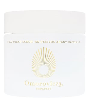 Revitalize your skin with the Omorovicza Budapest Gold Sugar Scrub, an exceptional exfoliating body treatment that removes dead skin cells. Infused with calming colloidal gold, this scrub smooths and nourishes the skin. Natural cane sugar lifts away impurities, promoting cell regeneration for soft, radiant skin. Key benefits include enhanced smoothness, improved radiance, and reduced appearance of age spots. Suitable for all skin types, it is free from parabens and artificial additives. Use 1-2 times a week in the shower, massaging in circular motions before rinsing.