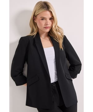 Stylish open-front design with notched lapels for a polished silhouette
        Distinctive ruched sleeves adding contemporary flair to classic tailoring
        Functional front pockets for practicality without compromising style
        Versatile woven fabric offering structure with comfortable movement
        Three-quarter length sleeves perfect for showcasing statement bracelets
    
    This Dorothy Perkins Ruched Sleeve Blazer effortlessly bridges the gap between smart and casual dressing. The thoughtfully designed ruched sleeves create visual interest whilst maintaining a refined aesthetic that works beautifully for evening occasions. Style with straight-leg trousers and a simple camisole as shown for drinks with colleagues, or pair with your favourite jeans and a silky blouse for weekend brunches with friends. The structured yet comfortable fit makes this blazer ideal for baby showers or informal gatherings where you want to look put-together without appearing overdressed. The versatile design allows for easy accessorising - add a delicate necklace and heeled sandals to enhance your look for evening events, or dress down with trainers for a contemporary smart-casual ensemble that's perfect for daytime socialising.