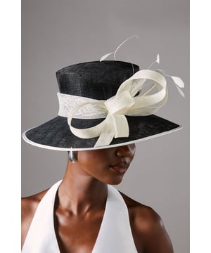 Offering a bold take on race-day style or adding a flair to wedding guest dressing, fascinators are our favourite accessory. Beautifully complementing our formal outfitting, this hat is an instant sartorial statement. Crafted out of signature sinamay, a natural straw fabric made from abaca fibres, this  piece uses structured twirls and quills to stand out, ensuring it is as delicate as it is beautiful. Delivered in a box.