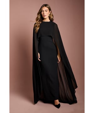 Dramatic cape sleeve design for a striking silhouette
        Floor-sweeping maxi length for an elegant look
        Fitted bodice accentuates the waistline
        Crew neckline adds a touch of sophistication
        Crepe fabric offers a luxurious drape and feel
    
    Make a grand entrance at your next formal event with this stunning cape sleeve maxi dress from Coast. The flowing cape sleeves create a captivating silhouette that's sure to turn heads, while the fitted bodice flatters your figure beautifully. Perfect for weddings, race days, or black-tie affairs, this dress exudes elegance and grace. Style it with strappy metallic heels and a sleek clutch for a refined ensemble. For cooler evenings, drape a pashmina over your shoulders to complement the cape design. The versatile crepe fabric ensures comfort throughout your special occasion, allowing you to dance the night away with ease. This Coast creation is a timeless piece that will have you feeling confident and sophisticated at any high-profile event.