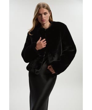 Elevate your outer layers with a classic jacket, with a comfortable, wide fit, and a statement, thick faux fur fabric. Style it with anything, from a skirt, to tailored trousers, to jeans for an elevated look that will take you seamlessly from day to night. Collarless Faux Fur Jacket High Quality, Plush Faux Fur Fabric Relaxed Silhouette Warm, High Neckline Casual, Collarless DesignShop this seasons faux fur coats and jackets or browse the full collection of coats and jackets now.