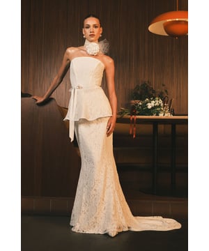 Exquisite lace maxi skirt with a striking peplum waistline for a flattering silhouette
        Elegant strapless design with optional high-neck lace collar detail for versatile styling
        Figure-enhancing fishtail hem with graceful train for dramatic movement
        Delicate all-over lace pattern showcasing intricate craftsmanship
        Satin waist tie to accentuate and define your shape
    
    Make a breathtaking entrance on your special day with this Coast Lace Bridal Maxi Skirt. The sophisticated peplum detail creates a stunning hourglass shape whilst the fishtail silhouette elegantly pools at your feet for that perfect bridal moment. Style with the matching lace collar for a contemporary twist on traditional bridal wear, or wear strapless for a classic, timeless look. The intricate lace pattern catches the light beautifully as you move, creating a truly magical effect for your walk down the aisle. Perfect for the modern bride seeking something uniquely elegant, this skirt pairs wonderfully with delicate pearl accessories and a simple bouquet. For a complete bridal ensemble, consider adding a cathedral-length veil to complement the graceful train of this exceptional Coast creation.