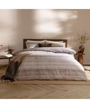 Transform your bedroom into a serene retreat with the Swift Duvet Cover Set. Crafted from 100% brushed cotton, this set offers an irresistibly soft touch that adds warmth and comfort to every sleep. Its double sided design features a blurred striped design in tranquil muted tones, for a relaxed and effortless look. Whether you’re curling up on a chilly evening or refreshing your space, this duvet cover effortlessly complements your style. Experience a deeper kind of comfort, night after night.