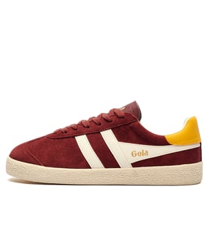 The Gola Medallist trainer blends vintage aesthetics with modern design cues. 
 Rooted in the brands 1973 archives, its minimalist upper and clean lines pay homage to classic sneaker styling, while the white-wrapped sole adds a contemporary edge. 
 The plush burgundy suede upper, accented by white Gola wingflash branding and a contrasting yellow heel tab, delivers a subtle yet distinctive look. Finished with Golas signature gold branding, the Medallist is a versatile, no-frills option designed for everyday wear.
 - Suede leather upper
 - Lace closure
 - Padded comfort insole
 - Rubber outsole
 - Gola Classics branding
