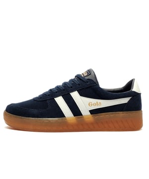 Inspired by vintage court shoes, the Grandslam blends sharp lines with a true heritage silhouette.
Featuring a suede leather upper, padded collar, and cushioned insole, these trainers are designed for all-day comfort without sacrificing style. Signature Gola branding give this timeless trainer contemporary edgeperfect for both casual and everyday wear.

- Sude leather upper
- Padded heel and ankle collar
- Comfort cushioned insole
- Secure lace up system
- Gola classic branding throughout