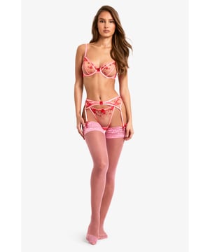 Delicate heart embroidery detailing
        Adjustable straps for a customised fit
        Sheer mesh panels for a sultry look
        Garter belt with detachable suspender straps
        Matching bra and knicker set included
    
    Indulge in romantic allure with this captivating Valentine's Day-inspired lingerie set from Boohoo. The intricate heart embroidery adds a playful touch, while the sheer mesh panels create a tantalising peek-a-boo effect. The garter belt features adjustable suspender straps, allowing you to pair it with your favourite stockings for a complete ensemble. Perfect for those special occasions when you want to feel confident and alluring, this set can be worn under your favourite party dress or saved for a private evening in. The versatile design ensures comfort without compromising on style, making it a must-have addition to your lingerie collection.