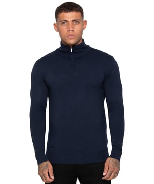 The Enzo Milano Men's Knitwear Half-Zip Sweatshirt features a stylish funnel neck design, adding a contemporary twist to classic knitwear. Made from soft, high-quality knit fabric, this sweatshirt ensures both comfort and warmth. The half-zip closure allows for adjustable ventilation and ease of wear, while the funnel neck provides additional coverage and a sleek, modern silhouette. It includes ribbed cuffs and hem for a snug fit, complementing the refined look. A small Enzo Milano logo plate is positioned near the hem. This knitwear piece effortlessly combines style and practicality, perfect for casual or semi-formal occasions.