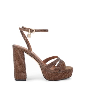 This Kurt Geiger Brixton Platform Sandal is crafted in a metallic gold tone satin fabric which is embellished with gold crystals. Heel height: 12.5cm.