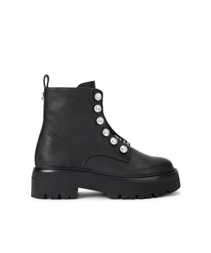 This Chain Ankle Boot features a pebble grain leather. There are statement antiqued brass chains across the tongue which are accented with large crystals where the eyelets sit.