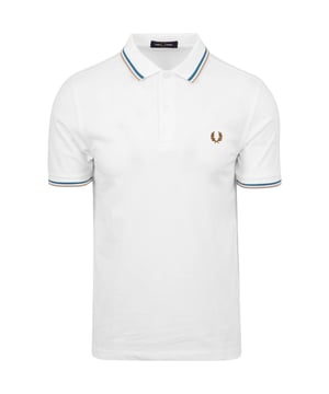 Elevate your casual wardrobe with the Fred Perry Brown Twin Tipped Collar White Polo Shirt. Crafted from 100% cotton, this polo offers breathable comfort and a soft feel perfect for all-day wear. Its classic white color is accented by a distinctive light blue and brown twin-tipped rib collar, creating a timeless look with a modern edge. Designed for men who appreciate quality and style, this shirt seamlessly pairs with jeans or chinos for versatile, effortless outfits. Manufactured with care, it combines durable construction with iconic Fred Perry detailing to enhance your everyday look