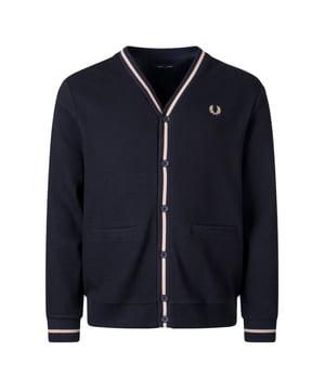 Elevate your wardrobe with the Fred Perry V-Neck Black Cardigan, crafted from 100% cotton for a soft, breathable feel. This men's cardigan features a classic V-neck design with a warm Stone-tipped pique texture that adds subtle sophistication to your look. Perfect for layering, it keeps you comfortable and stylish throughout the day, whether at work or casual outings. Made with quality craftsmanship, this versatile piece effortlessly blends timeless style with everyday practicality. Add this essential cardigan to your collection and experience the perfect combination of comfort, durability, and iconic Fred Perry design