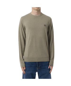 The Fred Perry Laurel Wreath Logo Warm Grey Jumper combines timeless style with cozy comfort, perfect for your everyday wardrobe. Crafted from 100% soft cotton, this jumper offers breathable warmth and a gentle feel against the skin. Its classic crew neck silhouette delivers a versatile look that pairs effortlessly with casual pants or layered under jackets. Featuring the iconic Laurel Wreath logo, it adds a subtle touch of heritage and sophistication to your outfit. Designed for men who appreciate quality and style, this jumper ensures lasting comfort and a sharp appearance for any occasion