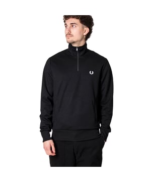 The Fred Perry Half Zip Branded Collar Black Track Jacket combines stylish design with practical comfort. Made from 100% polyester, this men's jacket offers a lightweight yet durable feel, perfect for everyday wear or athletic use. Its iconic branded collar adds a touch of sport-inspired sophistication, while the half-zip front allows for easy ventilation and adjustable fit. Designed for versatility and lasting quality, this track jacket is an essential piece for anyone seeking both casual style and reliable performance. Elevate your wardrobe with this timeless Fred Perry classic