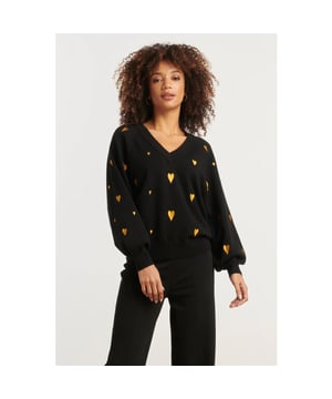 
Deze zwart-gouden knit top van Smashed Lemon is de perfecte combinatie van speelsheid en elegantie. De unieke haartjesstructuur geeft een feestelijke, opvallende touch aan je outfit, terwijl de V-halslijn en lange pofmouwen zorgen voor een vrouwelijk silhouet. De korte, losvallende pasvorm biedt comfort zonder in te leveren op stijl. Gemaakt van een hoogwaardige knit met 52% viscose, voelt deze top zacht en ademend aan op de huid – ideaal voor zowel feestelijke gelegenheden als stijlvolle dagelijkse looks. Belangrijke punten: - Zwart-gouden kleurcombinatie met subtiele glans - V-hals en lange pofmouwen voor een elegante, vrouwelijke uitstraling - Haartjesstructuur in de knit voor een unieke textuur en luxe gevoel - Losvallende, korte pasvorm – perfect voor laagjes of solo - Gemaakt van 52% viscose – licht, soepel en comfortabel Specificaties :

 
 * Stijl: Gebreide Tops 
 * Print: Haartjes 
 * Pasvorm: Losvallend 
 * Lengte: Kort 
 * Model is: 173 cm tall and wears size S/36 
 *