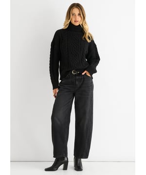 This Black Cable Knit High Neck Jumper combines cozy comfort with a bold, casual look. The intricate cable knit design adds texture and style, while the high neck ensures warmth on cooler days. Perfect for relaxed outings, it’s a versatile piece that keeps you comfortable and confidently dressed.