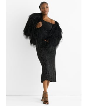 The Black Plain Fringe Faux Fur Short Jacket offers a bold, casual style with cozy comfort. Its soft black faux fur is enhanced by subtle fringe details, adding texture and movement to your look. Perfect for layering, this short jacket keeps you warm while making a confident fashion statement.