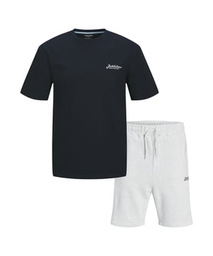 The Jack & Jones Men's Co-ord Set  will improve your casual wardrobe with its all-day comfort and effortless style. This matching set includes of a traditional crew neck short sleeve T-shirt and matching shorts, creating a modern and adaptable summer outfit. The T-shirt is made of soft, breathable cotton for a relaxed fit, and the shorts have a comfortable waistband for easy wear. This outfit is ideal for everyday use, relaxing, holidays, and casual events since it keeps you looking beautiful without losing comfort. The simple shape makes it easy to match with trainers or slides for a really casual look.