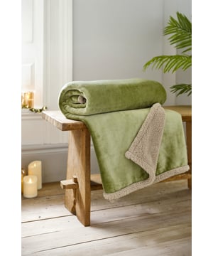 Bring a calming touch of nature indoors with the Hazelwood Throw in Sage. Measuring 130x170cm, this flannel and sherpa blanket is ultra-soft and wonderfully warm, perfect for adding both comfort and a subtle green accent to your home décor.