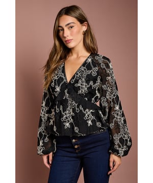 Elegant georgette blouse featuring intricate embroidery throughout
        Feminine frill detailing adds movement and dimension
        Flattering V-neckline frames the dcolletage beautifully
        Voluminous long sleeves create a dramatic silhouette
        Delicate ruffle hem detail for a sophisticated finish
    
    This exquisite Coast embroidered blouse combines timeless elegance with contemporary flair. The lightweight georgette fabric drapes beautifully, whilst the intricate embroidery creates a striking visual impact against the base fabric. Style with tailored trousers and pointed court shoes for formal occasions such as weddings or race days, where sophistication is paramount. For evening soires, pair with a sleek pencil skirt and statement earrings to highlight the beautiful V-neckline. The versatile design transitions effortlessly from day to night, making it an invaluable addition to your occasion wardrobe. The frill detailing adds a touch of romance and movement, ensuring you'll stand out for all the right reasons at your next special event.