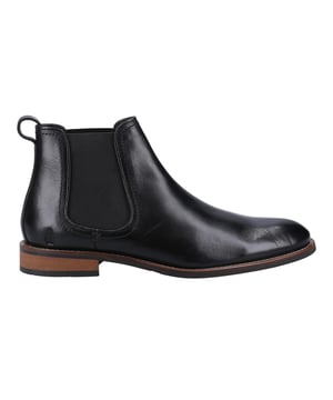 Marke: Hush Puppies. Obermaterial: Leder. Futterstoff: Stoff. Einlegesohle: gepolstert, Ortholite-Sohle. Laufsohle: Tunit. Doppel Elastischer Zwickel, Anziehlasche, Nahtverzierung. Absatz: Flach. Zum Fußgelenk. Design: Unifarben. Zehenstil: Rund. Zum Anschlüpfen.
