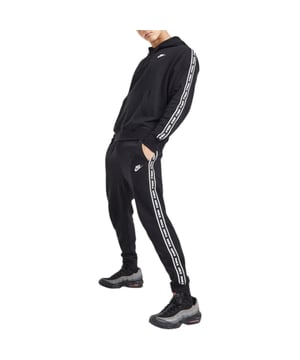Nike Tracksuit
	Style Name: Aries Club Tape
	Style Code: FB7296
	Made in Pakistan
	80% Cotton, 20% Polyester
	Soft and Warm
	Adjustable Drawcord Hood
	Fleece Joggers