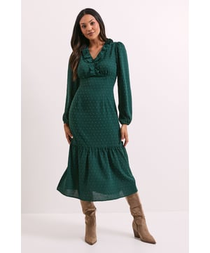 Elegant chiffon midi dress with delicate all-over pattern
        Feminine frill detail adorning the neckline for a sophisticated touch
        Flattering ruched bodice that enhances your silhouette
        Long sleeves with gentle volume for a graceful look
        Tiered hem detail adding movement and dimension to the dress
    
    This charming Dorothy Perkins midi dress combines comfort with effortless style for your everyday wardrobe. The ruched bodice creates a flattering fit while the frilled neckline adds a touch of femininity to the classic crew neck design. The flowing chiffon fabric drapes beautifully, with the tiered hem creating a graceful silhouette that moves with you. Style with ankle boots as shown for casual brunches with friends, or dress up with block heels for family gatherings and baby showers. The versatile design works wonderfully for daytime events when you want to look put-together without appearing overdressed. Layer with a cropped cardigan when the temperature drops, or add simple gold jewellery to enhance the dress's elegant appeal. This piece strikes the perfect balance between trend-conscious and timelessly wearable.