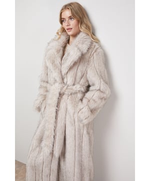 Luxurious faux fur texture creates a sumptuous feel and exceptional warmth
        Elegant maxi length design offers full coverage for colder days
        Practical self-tie belt to define your waist and create a flattering silhouette
        Generous collared neckline that can be styled up or down depending on the weather
        Functional side pockets perfect for keeping your hands warm or storing small essentials
    
    Make a statement this season with our Belted Fur Maxi Coat from Oasis. This show-stopping piece combines practicality with feminine style, featuring a dramatic full-length silhouette that provides exceptional warmth without compromising on elegance. The plush faux fur texture adds a touch of luxury to any casual ensemble, whilst the self-tie belt allows you to customise the fit to your preference. Style with your favourite denim jeans and a cable-knit jumper for weekend coffee dates or family gatherings. The versatile design pairs beautifully with ankle boots for a relaxed daytime look, or layer over a simple dress with flat shoes for a more polished casual event. This coat works wonderfully for autumn strolls, winter markets, or any occasion where you want to combine comfort with a touch of glamour.