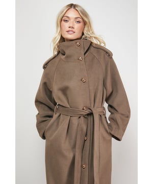 Distinctive funnel neck design for extra warmth and contemporary style
        Statement funnel sleeves with generous proportions for a fashion-forward silhouette
        Coordinating belt to define the waist and create a flattering shape
        Elegant button-through front closure with decorative gold-tone buttons
        Longline maxi length offering maximum coverage and dramatic flair
    
    This striking Oasis funnel sleeve coat combines practicality with feminine design elements for the perfect daywear statement piece. The dramatic funnel neckline frames your face beautifully whilst providing protection against chilly weather, whilst the distinctive funnel sleeves create a contemporary silhouette that sets this coat apart. Style with wide-leg trousers and a simple knit as seen on our model for an effortlessly chic daytime look. The adjustable belt allows you to customise the fit according to your preference - wear cinched for a defined waistline or loosely tied for a more relaxed feel. Perfect for weekend brunches, casual family gatherings or city explorations, this versatile coat will quickly become your go-to outerwear option for those cooler months when you want to look polished without compromising on comfort.