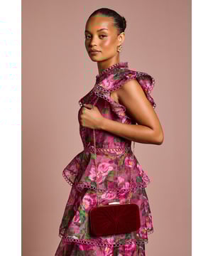 Sumptuous velvet clutch bag with elegant gathered detail
        Sleek metal frame with secure clasp closure
        Compact yet spacious interior with Coast branded lining
        Versatile chain strap that can be tucked away for hand-held styling
        Sophisticated design perfect for formal occasions and evening events
    
    The Beaut Velvet Clutch Bag showcases luxurious texture and refined craftsmanship that complements your most sophisticated ensembles. The gathered velvet creates a striking visual effect against the structured frame, offering both elegance and practicality. Style with a tailored evening dress or sleek jumpsuit for formal occasions, or pair with a chic blazer and tailored trousers for an elevated dinner look. The versatile design works beautifully for weddings, the races, or black-tie events where attention to detail matters. The chain strap provides carrying options, allowing you to keep your hands free for champagne flutes or greeting fellow guests. This Coast clutch bag adds the perfect finishing touch to your carefully curated occasion wardrobe, demonstrating your impeccable taste and eye for quality accessories.