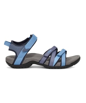 

     Artikel 4266-Tirra in kleur BLMU-Blue Multi is een prachtige blauwe sandaal, voor dames, van het merk Teva. De zool is van rubber. De voering is textiel. De voetwijdte is standaard.
    
    