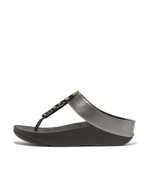 
Leave your accessories at home, these elegant sandals are all you need. Here in a high-glamour day-to-night version, they dress up any look with a trio of discs – smothered in sparkling tiny bead-size 'crystals' – set in shiny metal casings (that’s geometry we like). Soft uppers crafted in metallic pearlized faux-leather, including the toe post, add extra luster. With FitFlop’s supercushioned, pressure-diffusing Microwobbleboard midsoles underneath for non-stop ergonomic comfort. Whether you're heading for a night out or just want a hit of glitz, slip on for instant fabulousness. Note: Metal casings are recycled zinc.