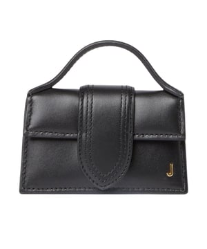 Jacquemus Le Petit Bambino Black Bag is crafted from 100% high-quality leather, offering a sleek and timeless look. Its compact design makes it the perfect accessory for carrying essentials while adding a touch of sophistication to any outfit. With its distinctive silhouette and durable material, this bag is both stylish and practical, ideal for daily use or special occasions. Elevate your wardrobe effortlessly with this elegant piece that combines luxury and functionality