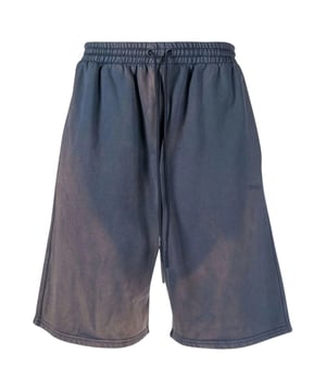 Off-White Diag Tab Vintage Skate Sweatshorts in Outerspace offer a perfect blend of style and comfort, crafted from 100% premium cotton for a soft, breathable feel. Made in Portugal, these sweatshorts feature a vintage-inspired design with the iconic Off-White diagonal tab detailing, ideal for skate enthusiasts and fashion-forward individuals alike. Their relaxed fit ensures ease of movement, making them perfect for active days or casual outings. Elevate your everyday wardrobe with these distinctive shorts that combine quality craftsmanship with modern streetwear appeal