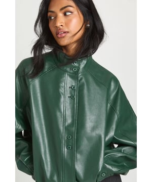 Classic bomber silhouette with contemporary faux leather finish
        High collar design with button-through front fastening
        Relaxed, oversized fit with dropped shoulders for effortless styling
        Ribbed cuffs for a secure, comfortable fit
        Versatile jacket that works across multiple seasons
    
    Make a statement with this bold faux leather bomber jacket, designed with an oversized silhouette that captures the essence of contemporary street style. The relaxed fit and high collar create a striking profile that's perfect for layering over basics. Style with wide-leg trousers and a simple crop top for an effortlessly cool daytime look, or throw over a mini dress with chunky trainers for casual weekend outings. The button-through front allows for versatile styling options-wear fully fastened for a structured look or open for a more relaxed vibe. This Boohoo bomber is ideal for family gatherings, coffee dates, or casual shopping trips, offering that perfect blend of fashion-forward design and everyday wearability. Complete the look with a baseball cap and minimal jewellery for an authentic urban aesthetic that's quintessentially British.