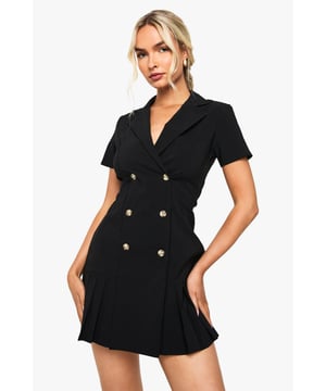 Structured blazer dress with classic collared neckline and double-breasted button fastening
        Flattering tennis skirt-inspired pleated hem for playful movement
        Short sleeves for versatile seasonal styling
        Bengaline fabric offers comfortable stretch with a smooth, tailored finish
        Decorative metallic buttons add a sophisticated touch to this statement piece
    
    Make a striking impression in this Boohoo Bengaline Tennis Skirt Blazer Dress, combining structured tailoring with playful design elements. The double-breasted silhouette creates a flattering shape whilst the pleated tennis skirt detail adds movement and flirtation to your look. Perfect for evening drinks or club nights, this dress works brilliantly with strappy heels and a compact clutch for a night on the town. For cooler evenings, layer with a cropped leather jacket and statement earrings. The collared neckline and button detailing offer a sophisticated edge that transitions seamlessly from after-work cocktails to weekend celebrations. Style with a sleek ponytail or loose waves to showcase the structured shoulders and complete your head-turning ensemble that's sure to make an impact on your next night out.